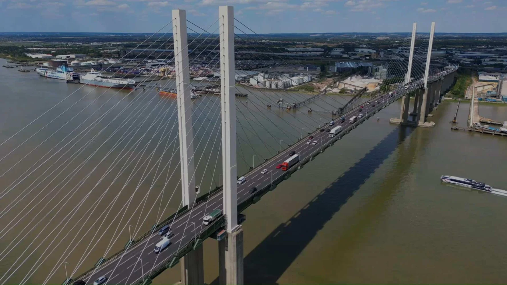 Bridge with traffic over water in an urban setting.